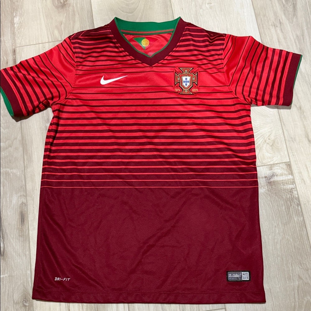 Free with any purchase. 
Nike 2014 2015 Portugal Home jersey